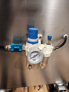 Advanced Dynamics Bottling Line Cleaning bottle by both liquid or air