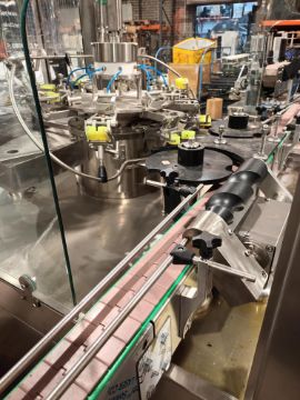 Advanced Dynamics Bottling Line Cleaning bottle by both liquid or air