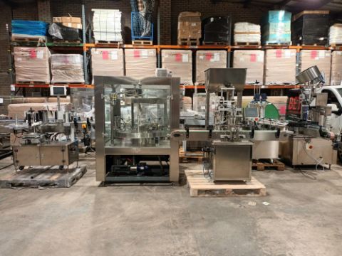Advanced Dynamics Bottling Line Cleaning bottle by both liquid or air